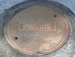 Manhole cover with Sewer label